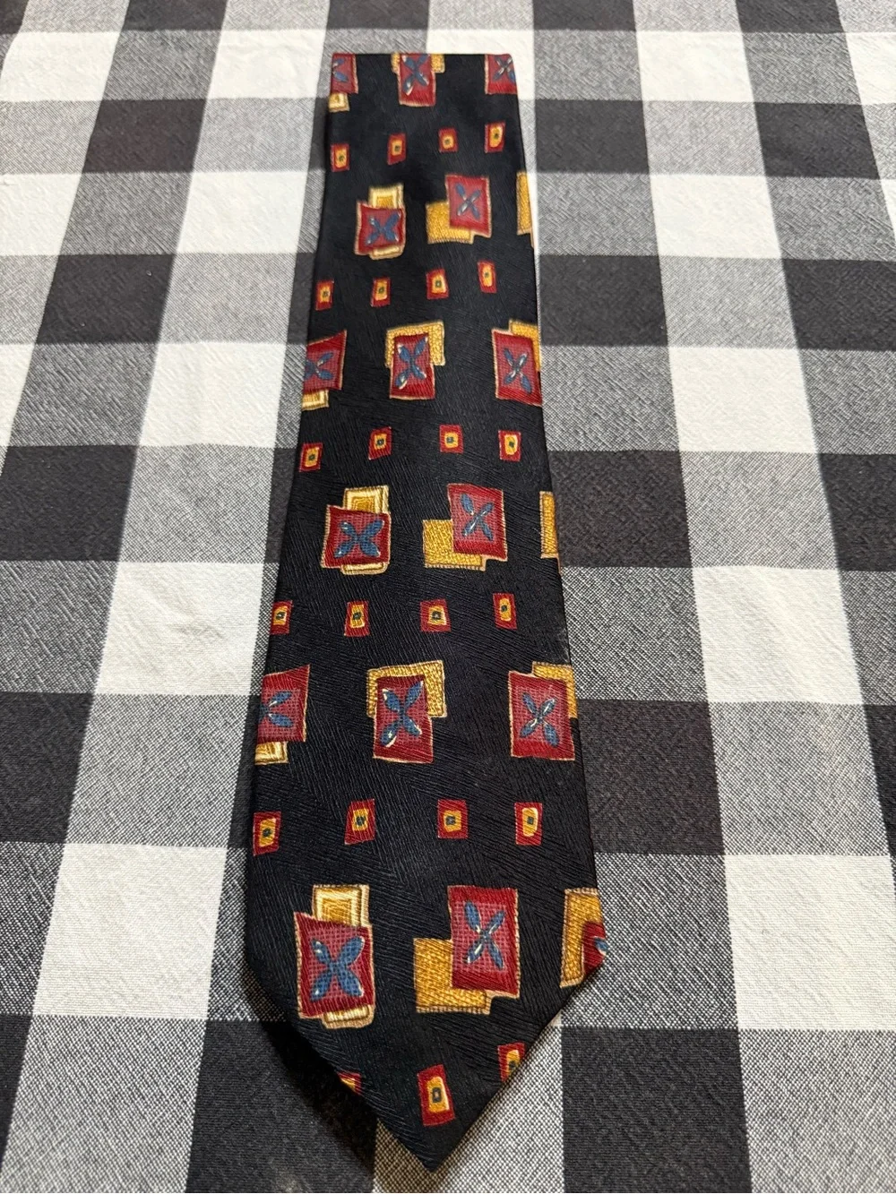 Black Tie with Red and Gold Geometric Motif